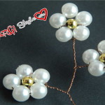 Accessori per capelli: fiori di perle intrecciati